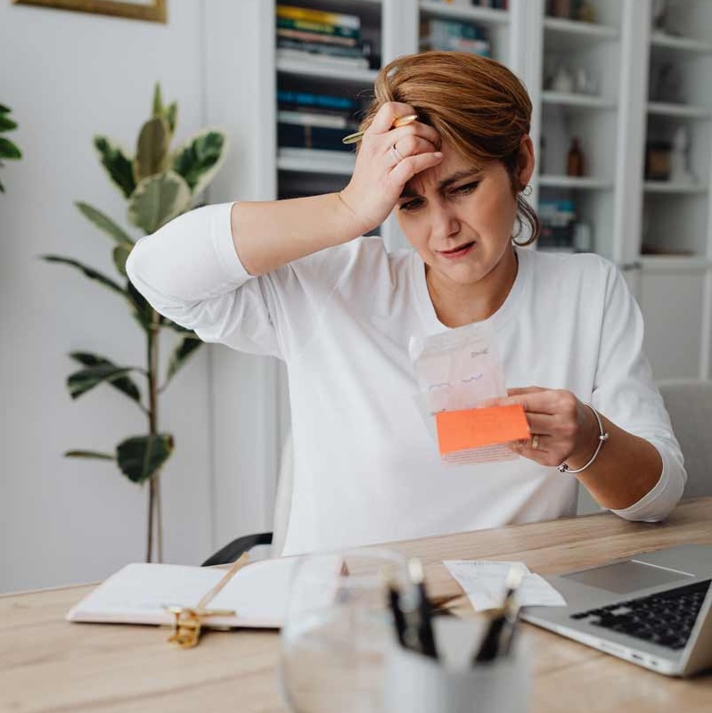 woman scratching head